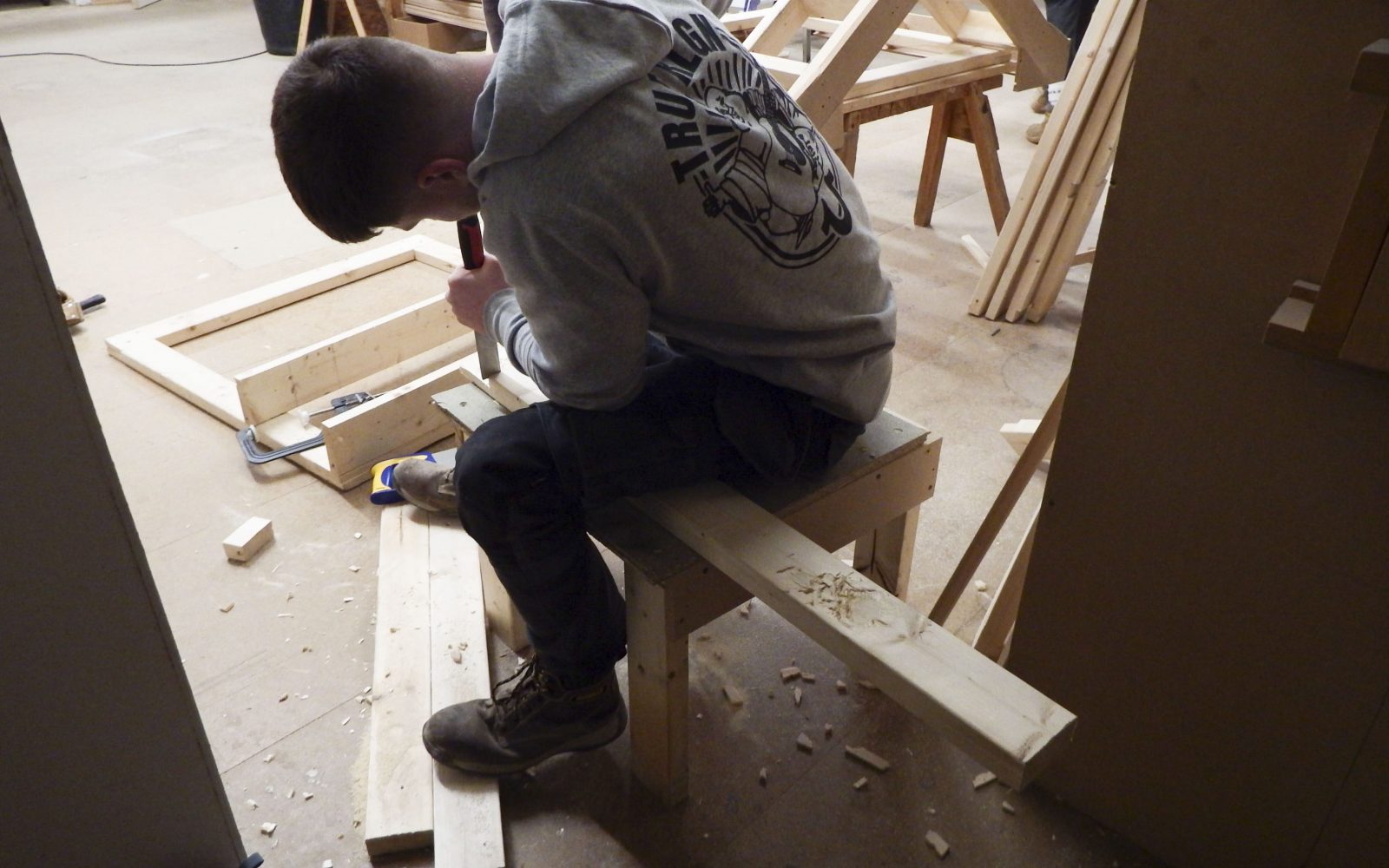 Student chiseling wood